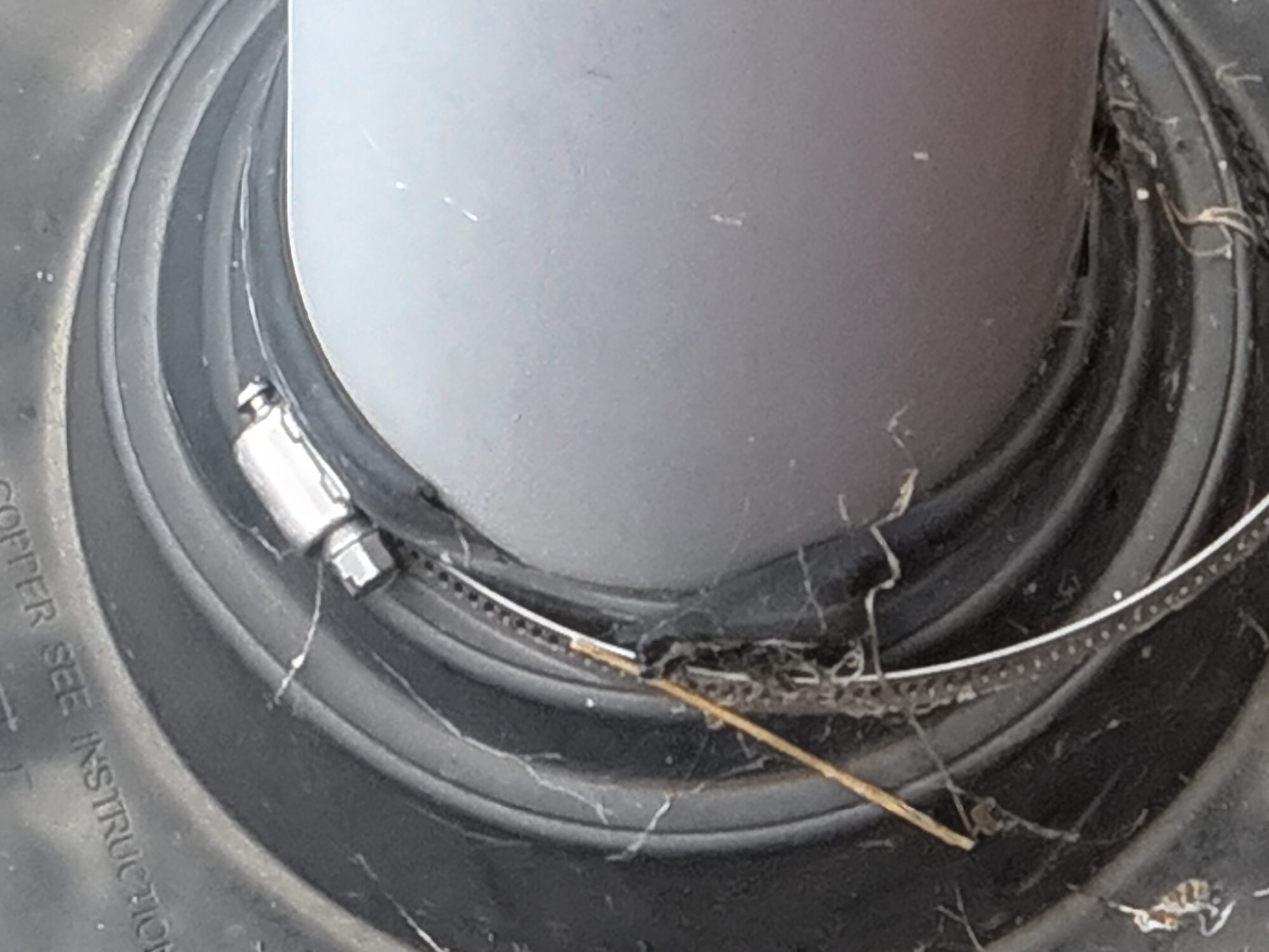 Drone imagery of roof damage to an extraction pipe..