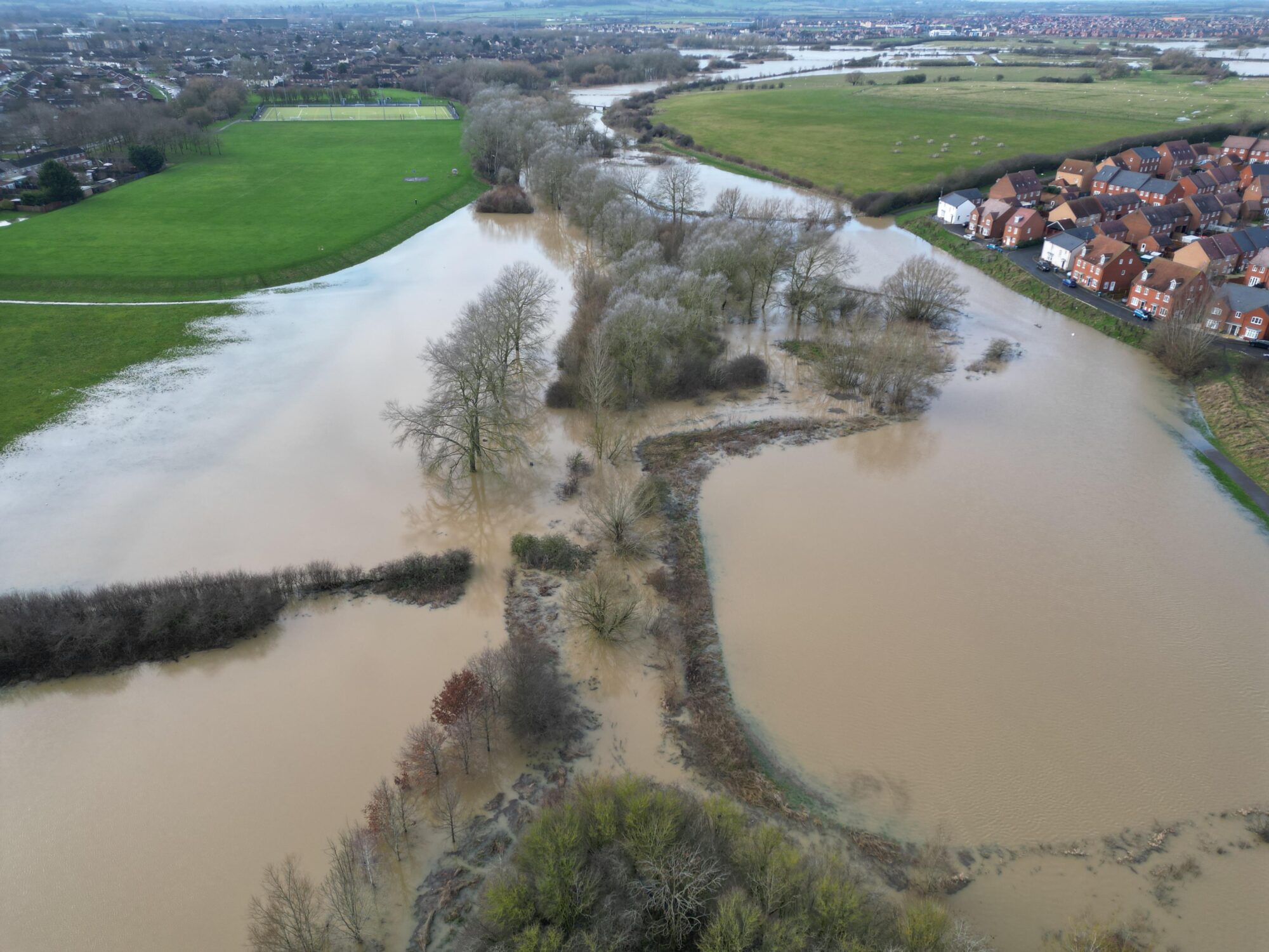 Drone imagery of flood waters. Looking west from Buckingham Park to Berryfields in north Aylesbury. Buckinghamshire. By skyeyeimagery.com