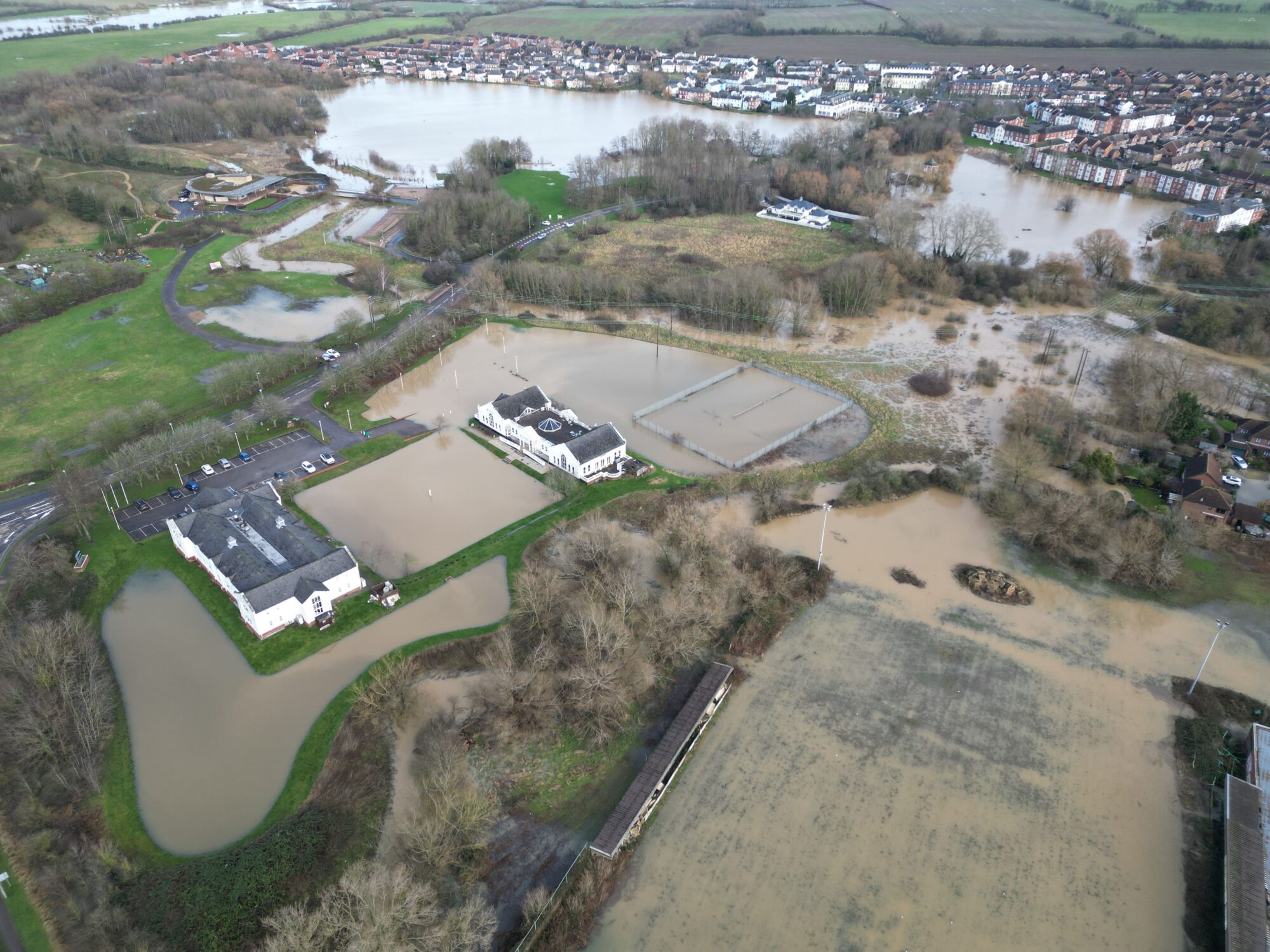 Drone imagery of flood waters. Garden Court Hotel in Watermead north Aylesbury is surrounded by flood waters, but still accessible. By skyeyeimagery.com