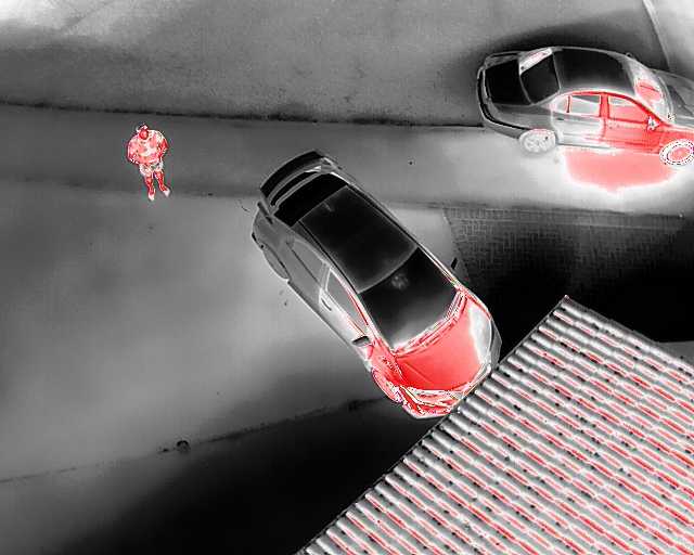 The IR Thermal imagery of a person stands out against the cooler background.