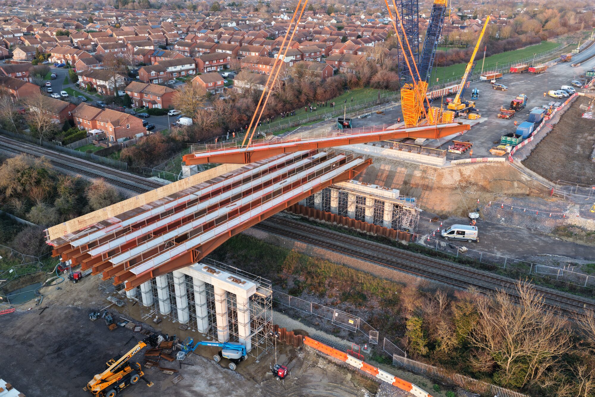 the 5th SEALR beam is being added to the 4 that have already been secured to the SEALR railway bridge.