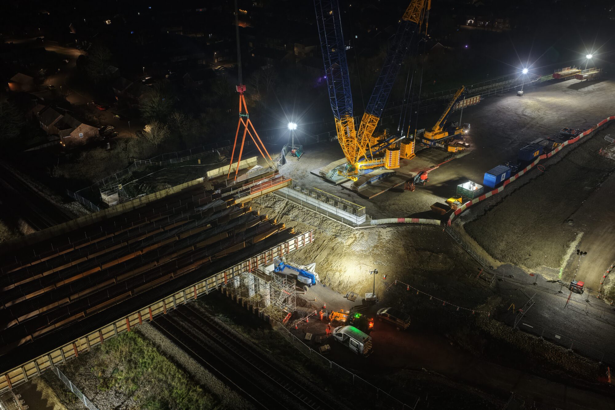 The shorter metal spans over the eastern end of the SEALR railway bridge are being moved into position.