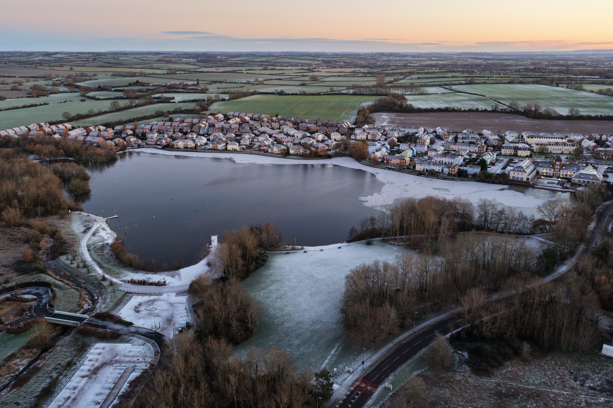 Aerial photograph of one of the Watermeads lakes partially frozen over due to the cold snap.