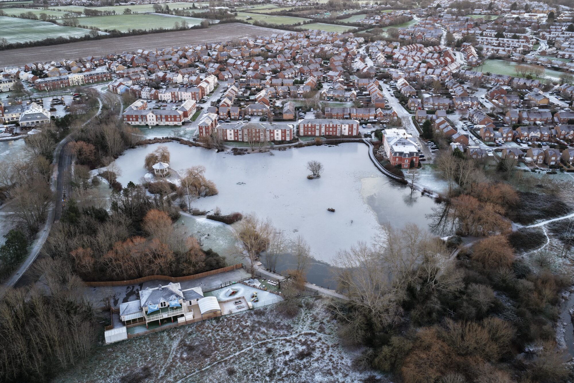 Aerial photograph of one of the Watermeads lakes partially frozen over due to the cold snap.