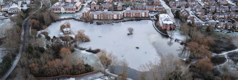 Aerial photograph of one of the Watermeads lakes partially frozen over due to the cold snap.