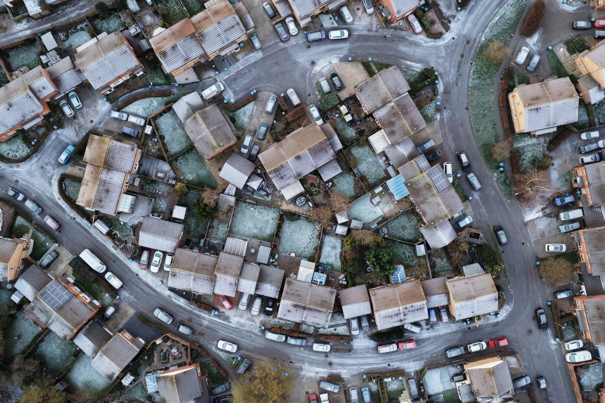A top down aerial photography of frost covered houses in Aylesbury.